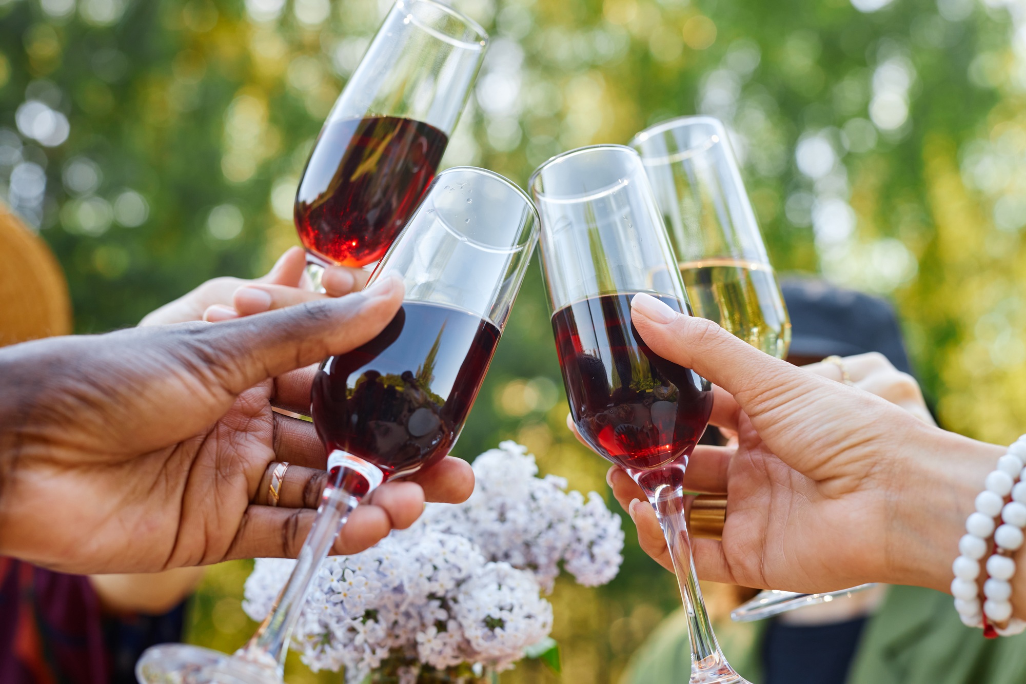 Toasting with Wine Glasses at Celebration Event